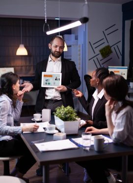 Business entrepreneur man presenting company statistics using tablet for financial presentation